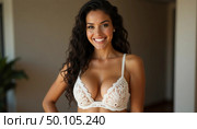 Radiating confidence, a graceful woman models exquisite lingerie in a sunlit room. The intricate design and her joyous expression highlight beauty and elegance in a cozy atmosphere Generative AI. Стоковое AI-изображение, AI-художник Юлия Петровская / Фотобанк Лори