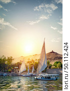 River Nile and boats at sunset in Aswan. Стоковое фото, агентство Ingram Publishing / Фотобанк Лори