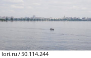 Voronezh, Russia, June 17, 2025: City of Voronezh near the reservoir, view from Petrovskaya embankment, floating boat. Стоковое видео, видеограф Катерина Белякина / Фотобанк Лори
