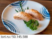 Burn Flaming Salmon Sushi in Traditional Japanese style plate. Стоковое фото, агентство Ingram Publishing / Фотобанк Лори