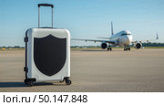 Stylish hardshell suitcase on airport runway. Стоковое AI-изображение, AI-художник Андрей Бакусов / Фотобанк Лори