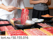Cooking of japanese wagyu beef Shabu Shabu set hot pot. Стоковое фото, агентство Ingram Publishing / Фотобанк Лори