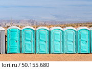 Row of public Portable mobile toilet on the street outdoor. Стоковое фото, агентство Ingram Publishing / Фотобанк Лори