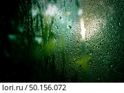 drops on glass , window condensation , and the background for dark text , spray on the window. Стоковое фото, агентство Ingram Publishing / Фотобанк Лори