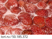 Homemade preparation of strawberry jam. Foam and juice when cooking strawberries. The process of making strawberry jam. Close-up of boiling strawberries. Стоковое фото, фотограф Андрей Жигальцов / Фотобанк Лори