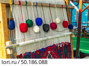 Balls of thread on a primitive loom for handicrafts. Стоковое фото, фотограф Константин Лабунский / Фотобанк Лори