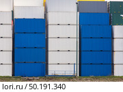 Cargo Containers Goods Stack at the Pier docks port waiting for international sea freight transportation in Rotterdam Port of Netherlands. Стоковое фото, агентство Ingram Publishing / Фотобанк Лори