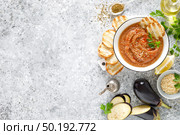 Eggplant hummus with ingredients for cooking. Traditional vegan arabic aubergine appetizer. Baba Ghanoush. Стоковое фото, агентство Ingram Publishing / Фотобанк Лори