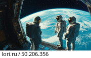 Astronauts looking at Earth planet from a space station during a mission in low Earth orbit. Стоковое AI-изображение, AI-художник Михаил Коханчиков / Фотобанк Лори