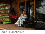 Restful Afternoon in a Country House Retreat Spent by a Young Woman. Стоковое фото, фотограф Aleksandr Golubev / Фотобанк Лори
