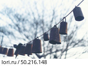 Bells arranged together during the sunset. Стоковое фото, агентство Ingram Publishing / Фотобанк Лори