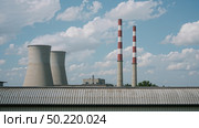 Industrial power plant with cooling towers and chimneys. Стоковое AI-изображение, AI-художник Андрей Бакусов / Фотобанк Лори