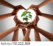 Earthday or earth day as group of diverse people joining to form heart hands connected together protecting the environment and promoting conservation and climate change issues as an image composite. Стоковое фото, агентство Ingram Publishing / Фотобанк Лори