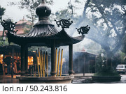 Incense burner in a temple in Hong Kong. Стоковое фото, агентство Ingram Publishing / Фотобанк Лори