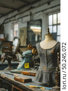 A table showcasing multiple types of sewing machines, each with unique features and designs, creating a diverse display of equipment. Стоковое AI-изображение, AI-художник Данила Большаков / Фотобанк Лори