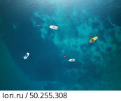 Boats. Aerial view of boats in sea. Beautiful summer seascape with ships, clear azure water at sunny day. Top view. Стоковое фото, агентство Ingram Publishing / Фотобанк Лори