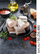 Raw fresh sliced hake fish with ingredients for cooking. Стоковое фото, агентство Ingram Publishing / Фотобанк Лори