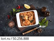 Hake fish, cooked in tomato sauce with vegetables and spices. Стоковое фото, агентство Ingram Publishing / Фотобанк Лори