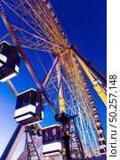 Cabins of Ferris Wheel and blue sky. Ferris wheel at night. Стоковое фото, агентство Ingram Publishing / Фотобанк Лори