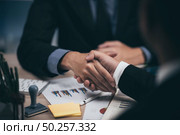 Two confident business man shaking hands during a meeting in the office, success, dealing, greeting and partner concept. Стоковое фото, агентство Ingram Publishing / Фотобанк Лори