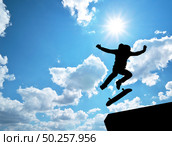 Skater jump silhouette and blue sky. Element of design. Стоковое фото, агентство Ingram Publishing / Фотобанк Лори