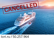 Cruise ship travel holidays cancelled because of epidemic of coronavirus. Crisis in the cruise industry. Cruise cancellation because of pandemic of Covid-19. Quarantine in cruise liner. Red text. Стоковое фото, агентство Ingram Publishing / Фотобанк Лори