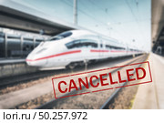 Trains cancelled due to pandemic of coronavirus. Passenger railway travel and transportation cancellation due to epidemic of Covid-19.  Background with railway station, high speed train and text . Стоковое фото, агентство Ingram Publishing / Фотобанк Лори