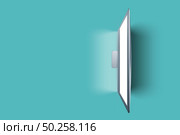 Top view above white empty computer monitor on a turquoise table, copy space. Working home, remotely concept.. Blank computer display on a turquoise table. Стоковое фото, агентство Ingram Publishing / Фотобанк Лори