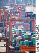 Working at Tsing yi Hong Kong Port for shipping and freight transportation with truck and boat for global business import and export background. Стоковое фото, агентство Ingram Publishing / Фотобанк Лори