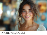Portrait of a young woman with a wide, sincere smiling face, shot against the background of softly blurred interiors. The girl has natural makeup, a loose hairstyle with careless curls, freckles on her face and light boho-style clothes. Her radiant smile, well-groomed skin and expressive eyes create an image of health, happiness and inner harmony. Ideal for themes of female beauty, naturalness, youth, happiness, lifestyle and advertising campaigns in the field of health and cosmetics. Стоковое AI-изображение, AI-художник Анна Кривицкая / Фотобанк Лори