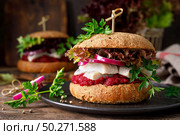 Sandwiches, hamburgers with homemade wholemeal bread, herring, puree of beetroot, red onion, parsley and fresh lettuce salad. Стоковое фото, агентство Ingram Publishing / Фотобанк Лори