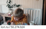Children Drinking Juice on a Birthday Party at Home. Siblings, girls and a boy together celebrating a party, eating cake sitting at festive table. Little Kid Celebration. Surprise. Low key. Стоковое видео, видеограф Марина Демидюк / Фотобанк Лори