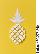 Exotic fruits composition creative pineapple handmade from rafined anf granulated sweet sugar on a yellow background with copy space. Flat lay.. Pineapple fruit handmase from pressed and granulated sweet sugar. Стоковое фото, агентство Ingram Publishing / Фотобанк Лори