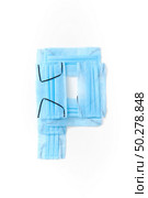 Capital letter P handmade from medical antibacterial protective blue face masks on a white background, copy space. Creative alphabet for making up new words.. Letter P made from protective medical masks on a white background. Стоковое фото, агентство Ingram Publishing / Фотобанк Лори