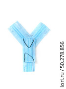 Capital letter Y handmade from medical antibacterial protective blue face masks on a white background, copy space. Creative alphabet for making up new words.. Letter Y made from protective medical masks on a white background. Стоковое фото, агентство Ingram Publishing / Фотобанк Лори