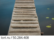 Lake of the woods, water lilies on the water and wooden walkways. Стоковое фото, фотограф Марина Демидюк / Фотобанк Лори