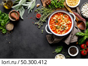 Cooking pasta e fagioli soup with chicken meat and vegetables, italian cuisine. Стоковое фото, агентство Ingram Publishing / Фотобанк Лори