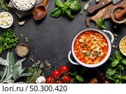 Cooking pasta e fagioli soup with chicken meat and vegetables, italian cuisine. Стоковое фото, агентство Ingram Publishing / Фотобанк Лори