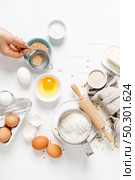 Baking homemade bread on white kitchen worktop with ingredients for cooking, culinary background, copy space, overhead view. Стоковое фото, агентство Ingram Publishing / Фотобанк Лори