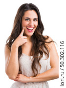 Beautiful woman smilling, isolated over a white background. Стоковое фото, агентство Ingram Publishing / Фотобанк Лори