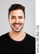 Portrait of a beautiful latin man smiling. Стоковое фото, агентство Ingram Publishing / Фотобанк Лори