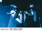 The concept of modern medical laboratory equipment, close up of objective lenses of a microscope. Стоковое фото, агентство Ingram Publishing / Фотобанк Лори