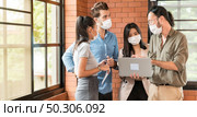 Panoramic web banner crop. Group of business worker team meeting and brainstorm for startup new business. They wear protective face mask in new normal office preventing coronavirus COVID-19 spreading. Стоковое фото, агентство Ingram Publishing / Фотобанк Лори