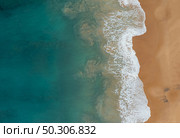 An aerial shot of the beautiful ocean waves meeting the sands on the beach. Aerial shot of the beautiful ocean waves meeting the sands on the beach. Стоковое фото, агентство Ingram Publishing / Фотобанк Лори
