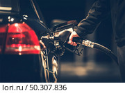 Car Refueling at the Gas Station. Gas Pump Nozzle. Стоковое фото, агентство Ingram Publishing / Фотобанк Лори