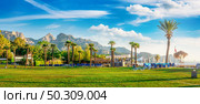 Park and mountains in Kemer at summer day, Turkey. Стоковое фото, агентство Ingram Publishing / Фотобанк Лори