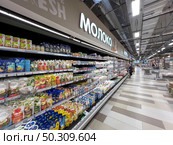 A refrigerator with an assortment of dairy products from the Spar supermarket in close-up. Russia. Moscow. 22.06.25. Редакционное фото, фотограф Ярославский Максим / Фотобанк Лори