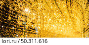 abstract blurry bokeh background of night light, Christmas party background, blurry patten in gold bright shiny, defocused disco illuminated design. Стоковое фото, агентство Ingram Publishing / Фотобанк Лори