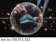 businessman holding money on hand, money economic and marketing concept with world map graphic, global digital finance market trade, stock datum chart success. Стоковое фото, агентство Ingram Publishing / Фотобанк Лори