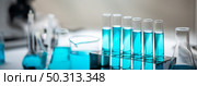 test-tube and laboratory glassware setting for science research, medical study, experiments for researching modern medical innovations, blue liquid sample test. Стоковое фото, агентство Ingram Publishing / Фотобанк Лори